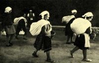 139. Women carrying bundles