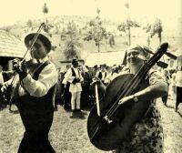 255. Musicians at a wedding, with fiddle and drum-bass