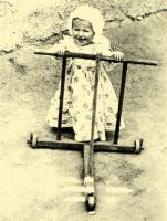 277. Child pushing a cart